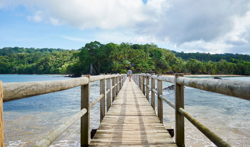 Jetty bridge with man walking to Bom Bom
