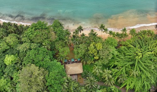 Aerial view of Bom Bom Beach Club on the shoreline of Príncipe Island